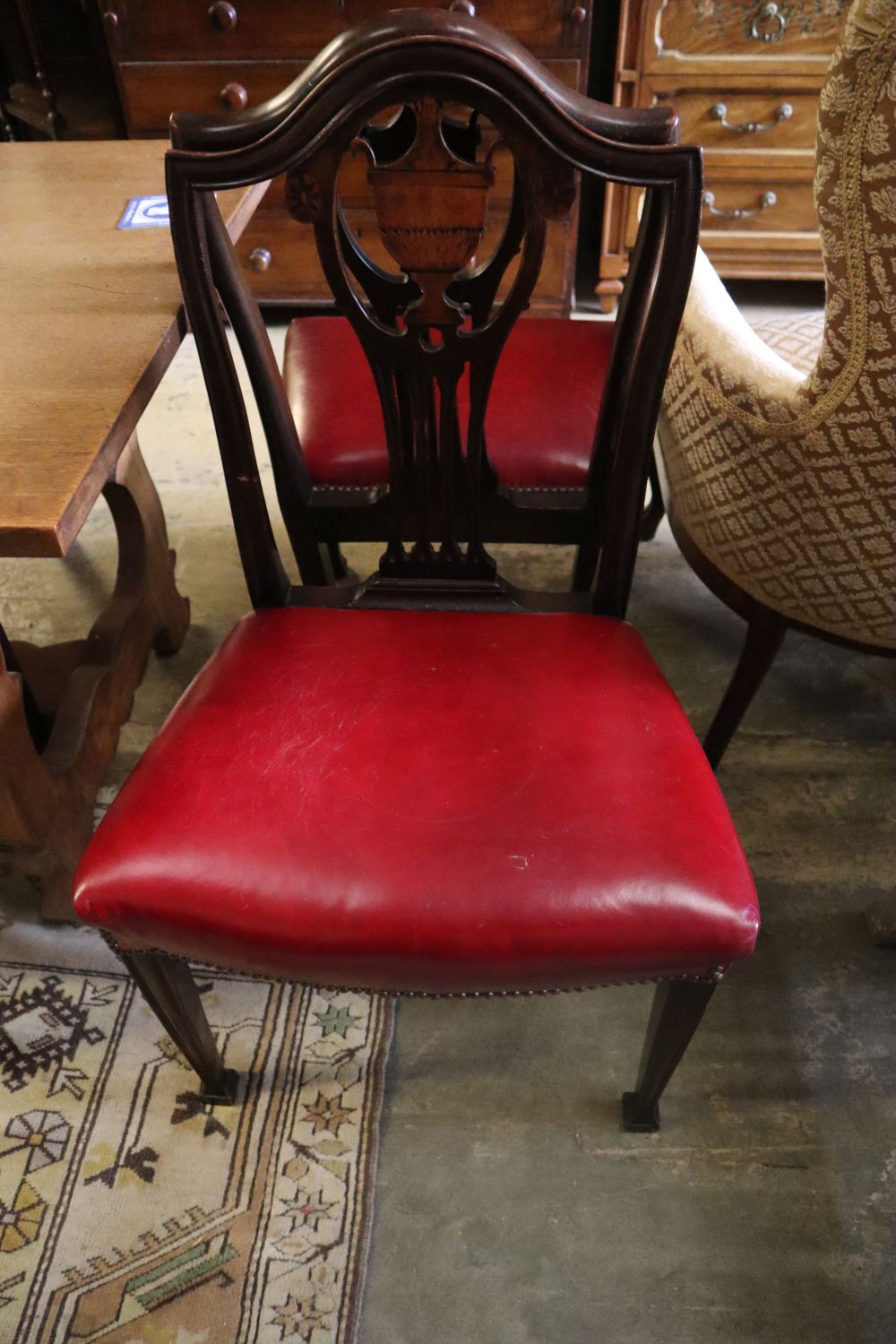 A set of eight George III inlaid mahogany dining chairs (2 with arms)